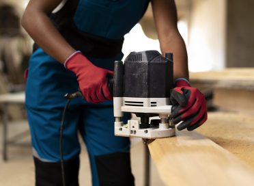 carpenter-cutting-mdf-board-inside-workshop